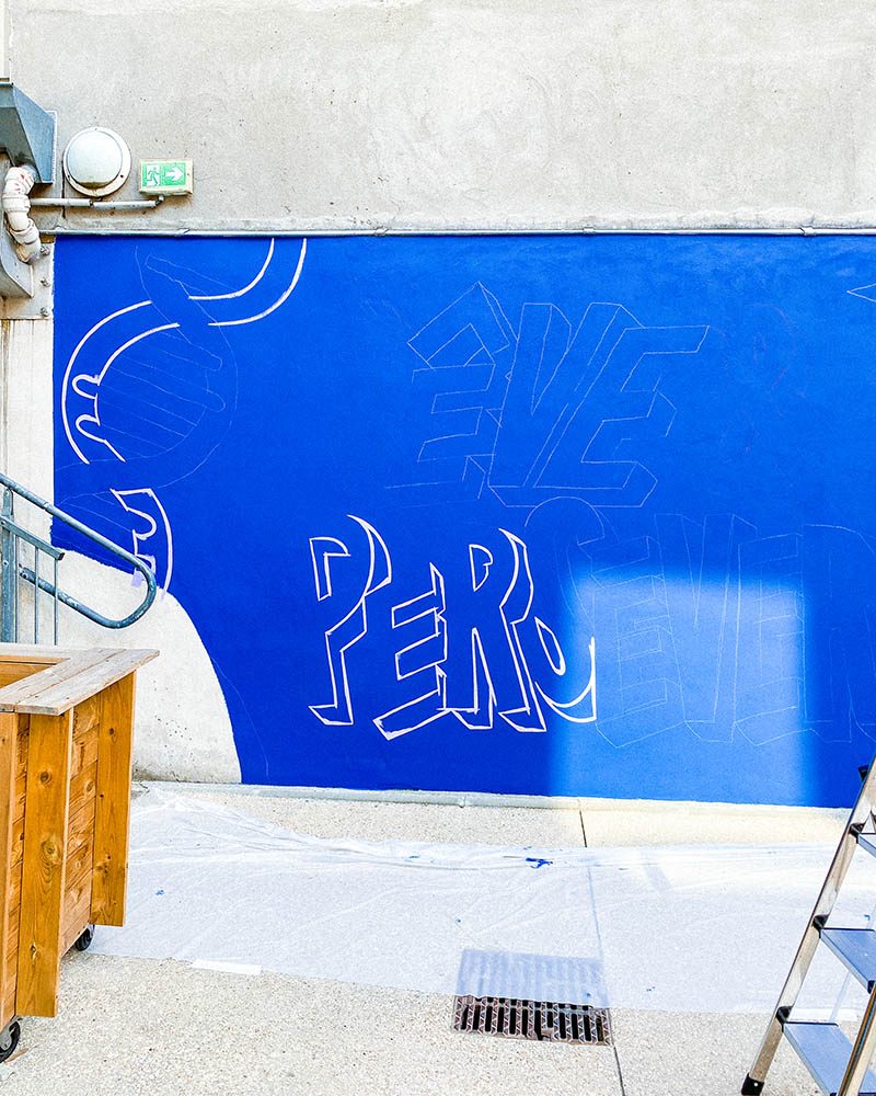 mural in progress school courtyard