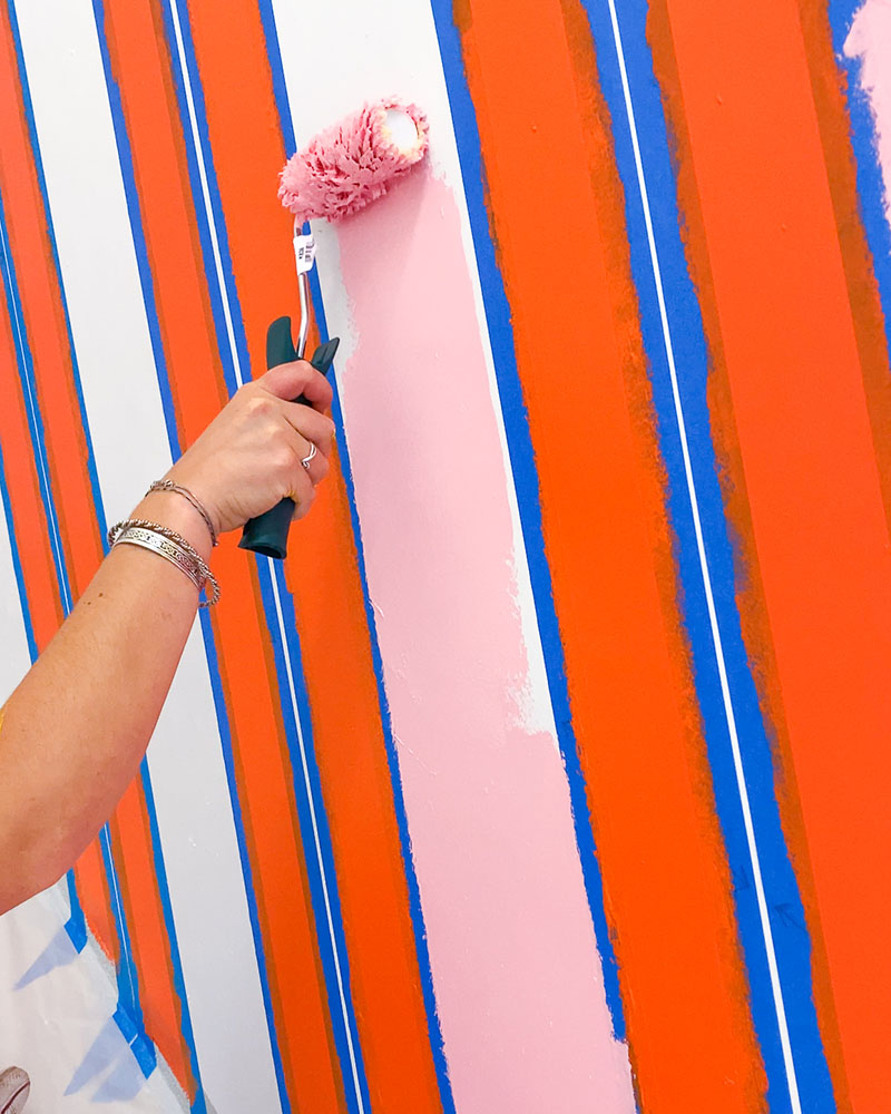 painting lines on a mural